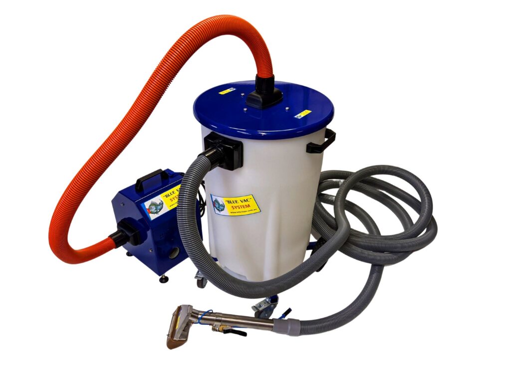 BlueVac captive-head washing system cleaning a masonry surface
